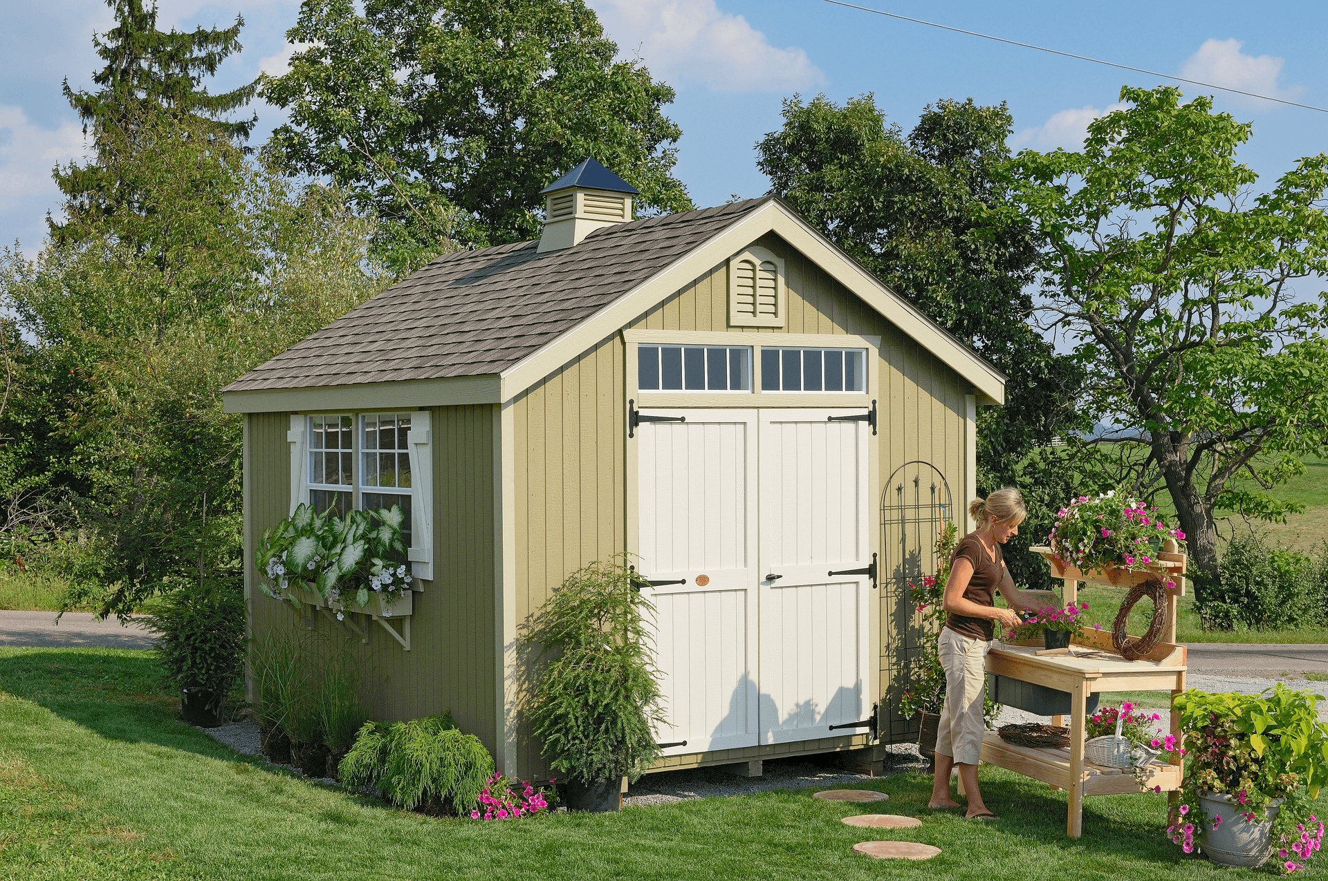 Rendering of a Value Gable Shed with a lawnmower and bicycle in the foreground